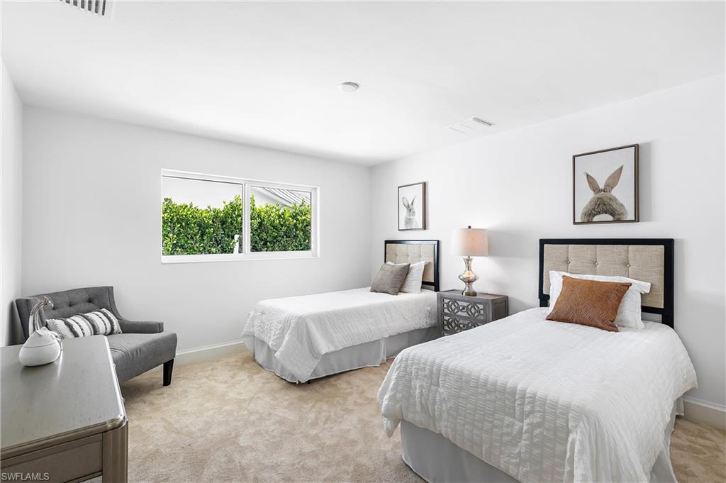 2001 Alamanda Drive Naples, FL 34102 - Photo 15 of 32 a bedroom with two beds and a window