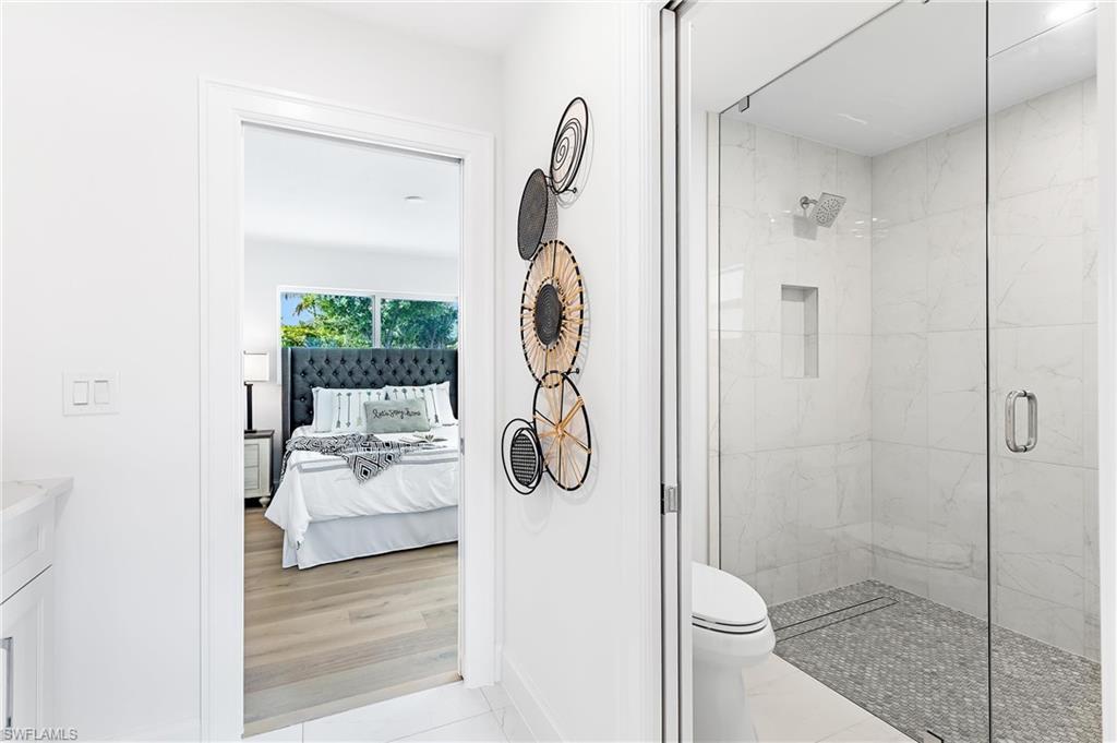 2001 Alamanda Drive Naples, FL 34102 - Photo 19 of 32 a bathroom with a shower