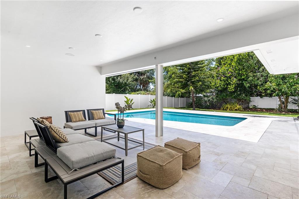 2001 Alamanda Drive Naples, FL 34102 - Photo 24 of 32 a living room with furniture and a large window
