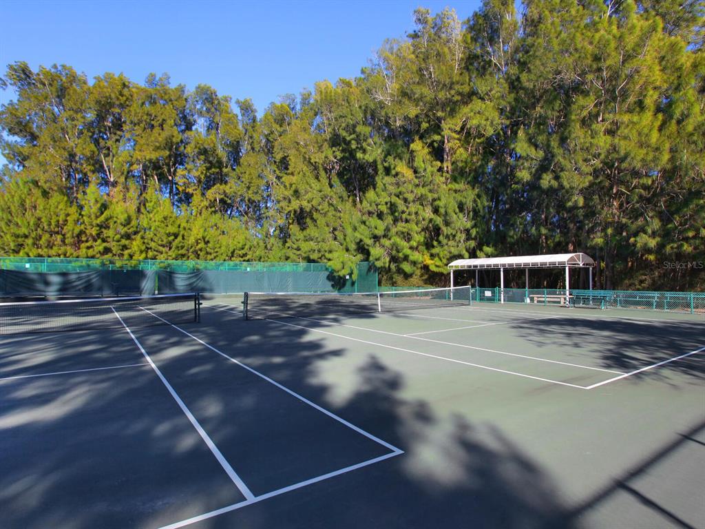 7219 Pine Needle Road Sarasota, FL 34242 - Photo 20 of 30 a view of a tennis court