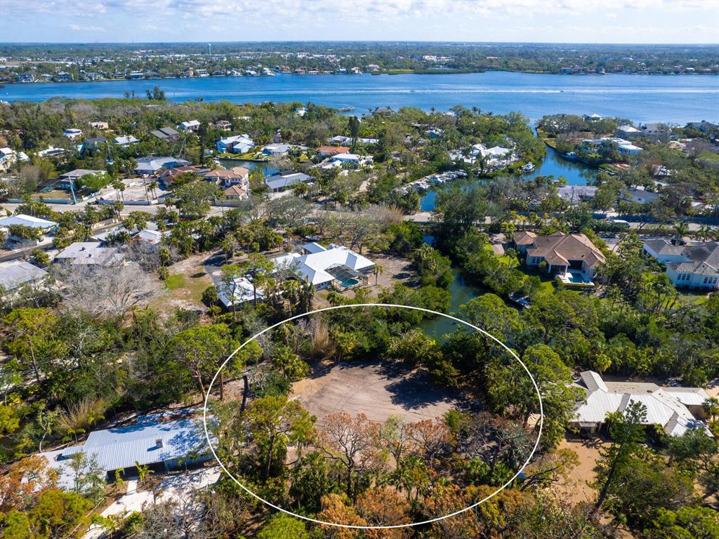 7219 Pine Needle Road Sarasota, FL 34242 - Photo 2 of 30 an aerial view of a houses with a yard