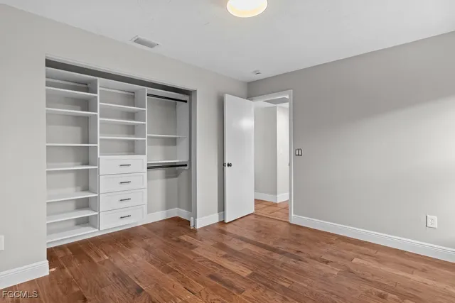 a bathroom with a toilet a sink and a mirror