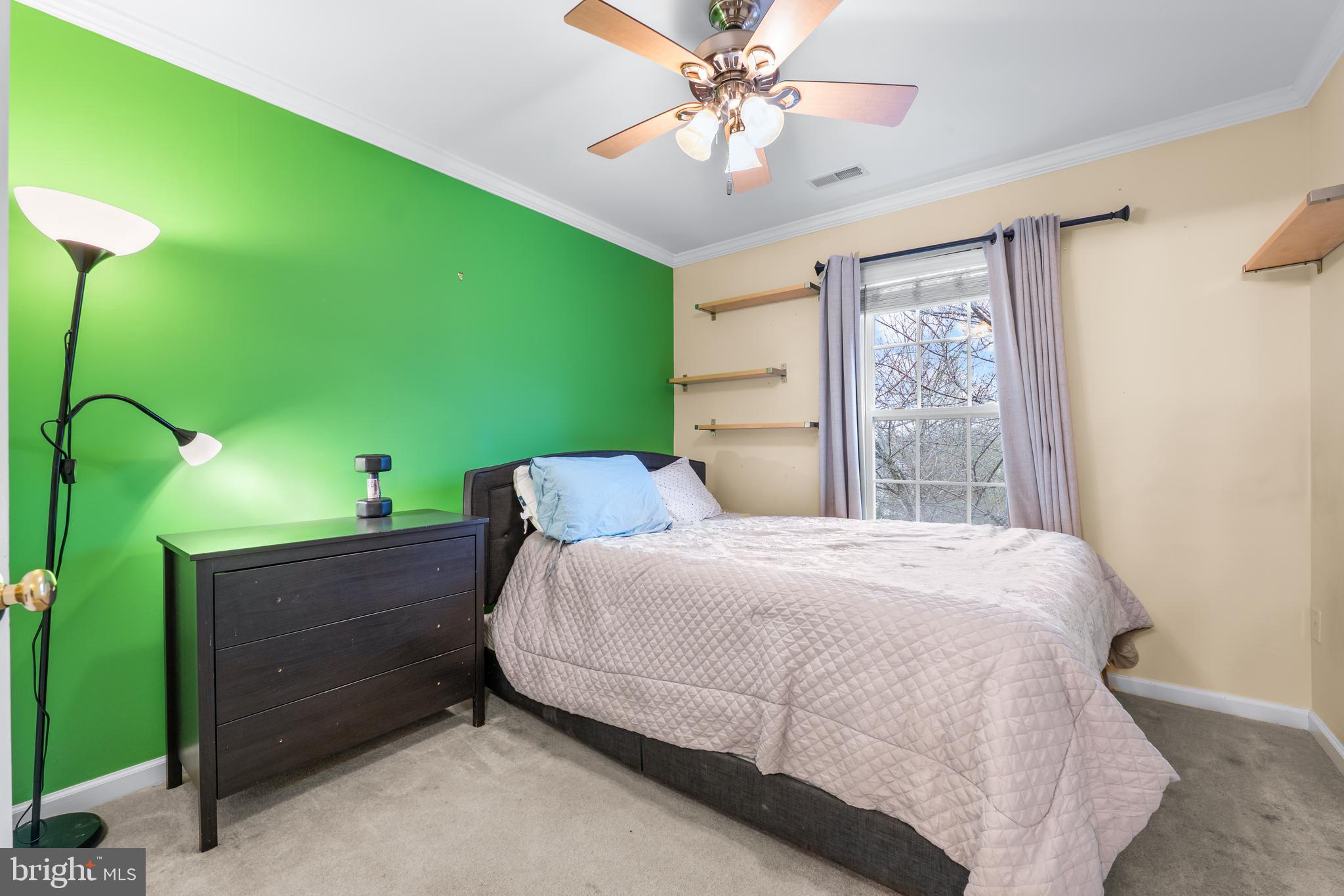 1067 Campbell Meadows Road Owings Mills, MD 21117 - Photo 14 of 32 a bedroom with a bed dresser and a window