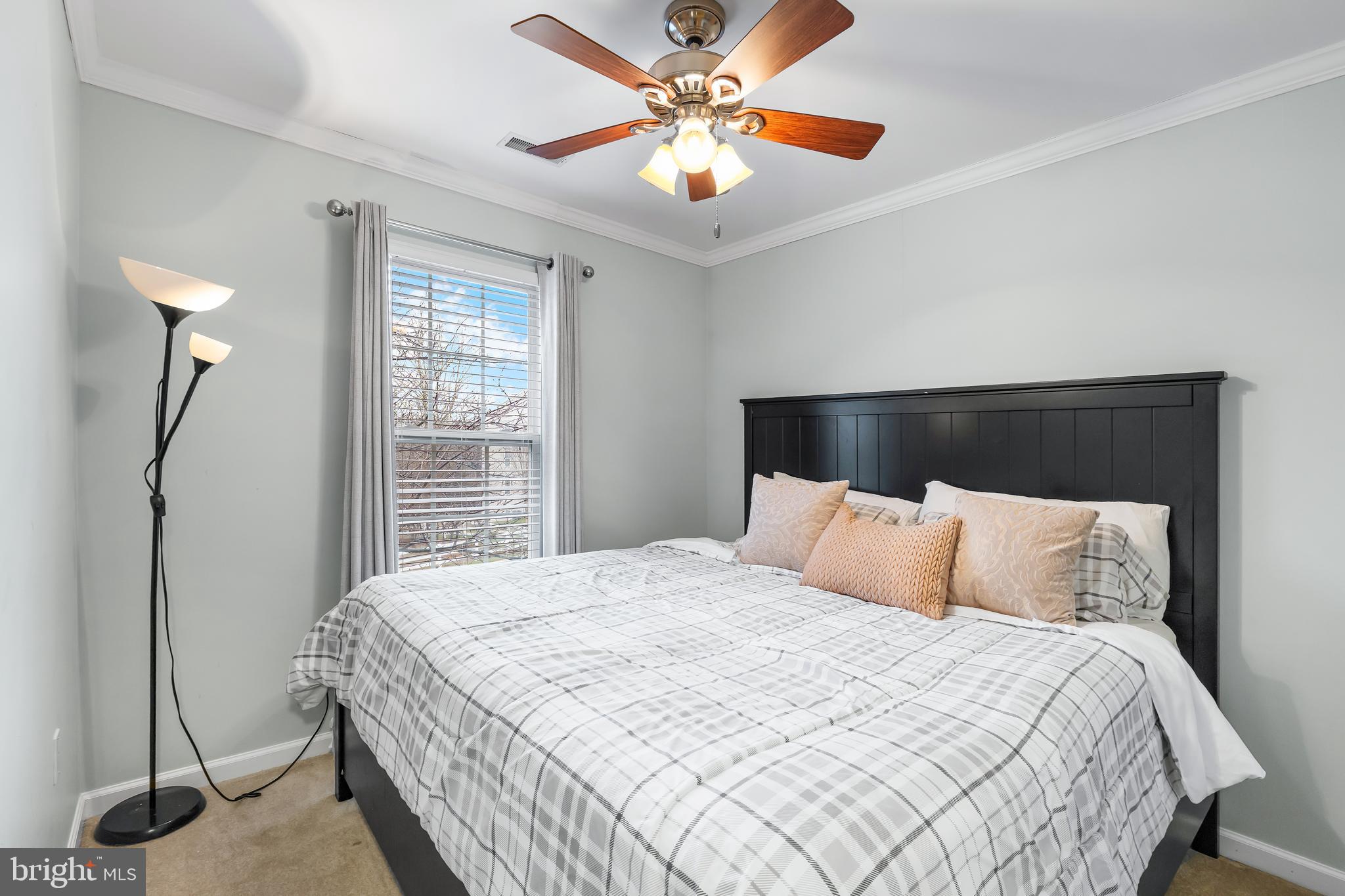 1067 Campbell Meadows Road Owings Mills, MD 21117 - Photo 15 of 32 a bedroom with a bed and a ceiling fan