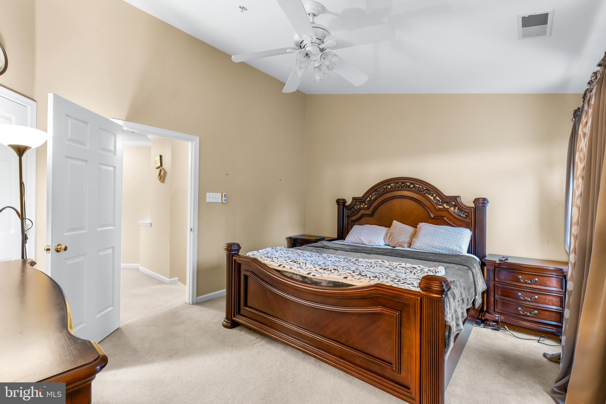 1067 Campbell Meadows Road Owings Mills, MD 21117 - Photo 20 of 32 a bedroom with a bed and a chandelier