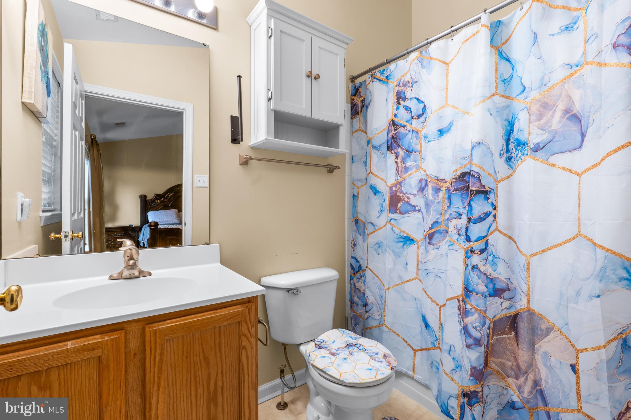 1067 Campbell Meadows Road Owings Mills, MD 21117 - Photo 21 of 32 a bathroom with a sink and mirror with toilet