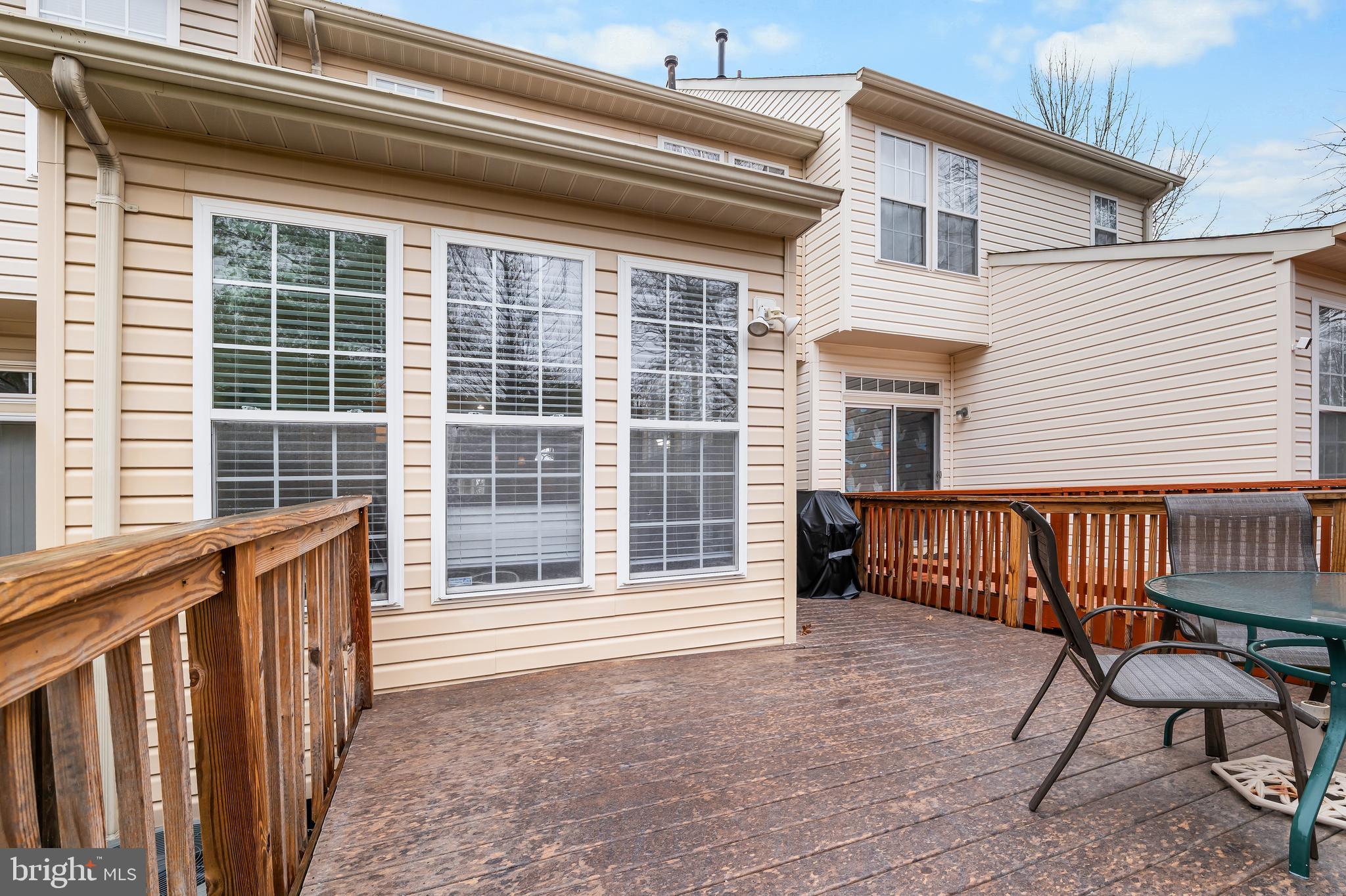1067 Campbell Meadows Road Owings Mills, MD 21117 - Photo 32 of 32 a view of a house with wooden deck and a bench