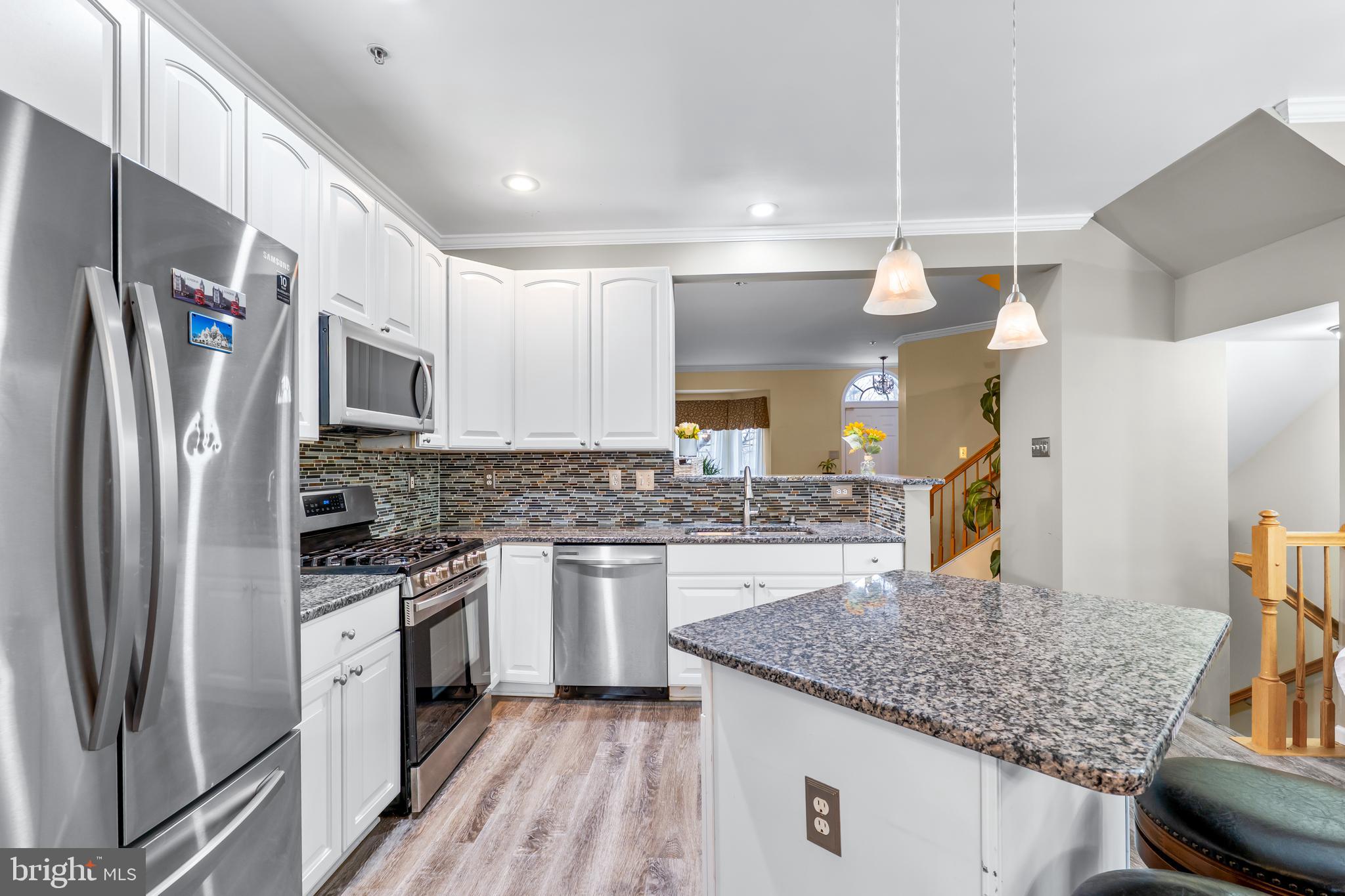 1067 Campbell Meadows Road Owings Mills, MD 21117 - Photo 10 of 32 a kitchen with stainless steel appliances granite countertop a sink stove and refrigerator