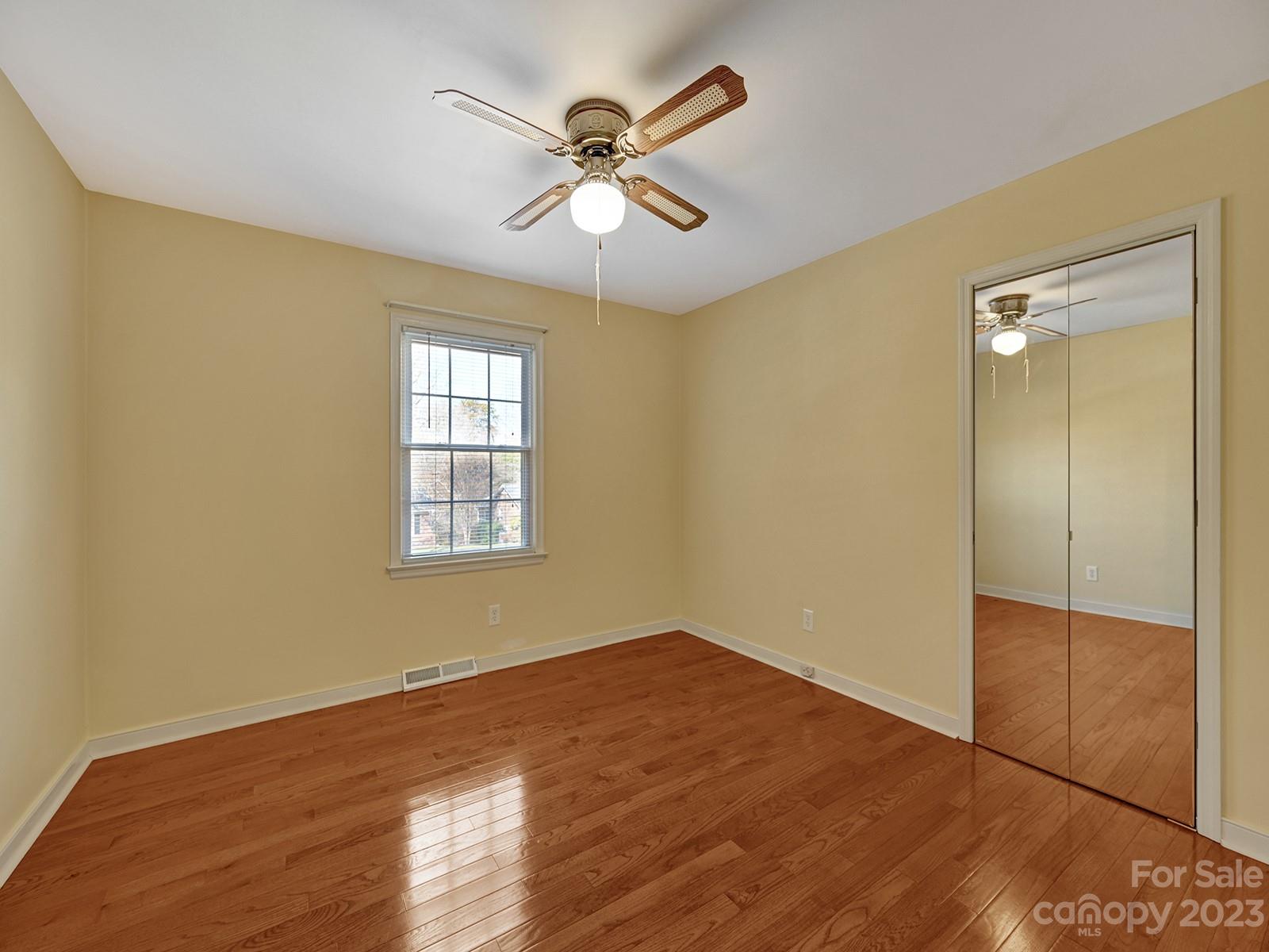 4130 Witherow Road Winston-Salem, NC 27106 - Photo 15 of 39 wooden floor in an empty room with a window