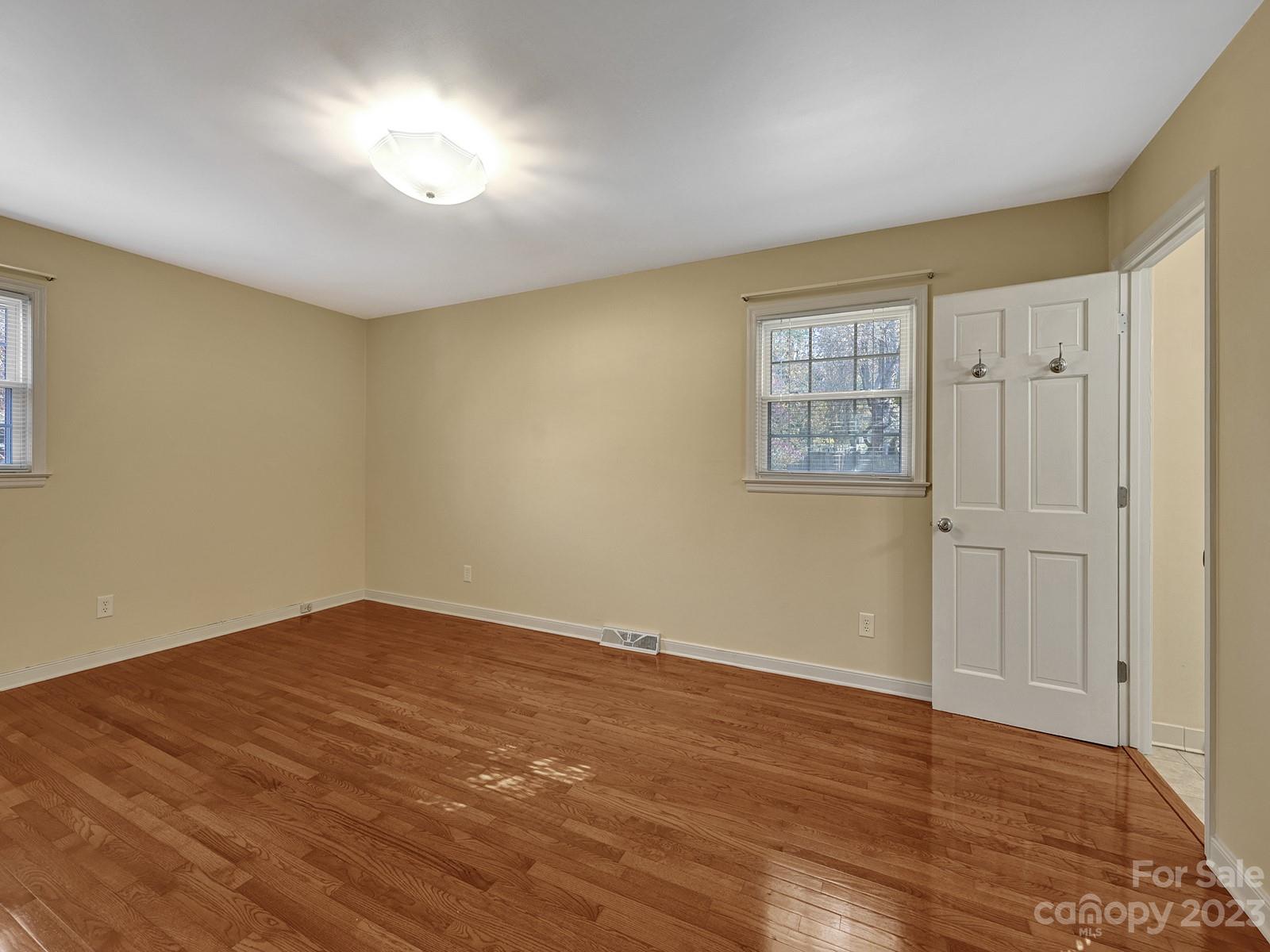 4130 Witherow Road Winston-Salem, NC 27106 - Photo 22 of 39 a view of empty room with wooden floor and fan