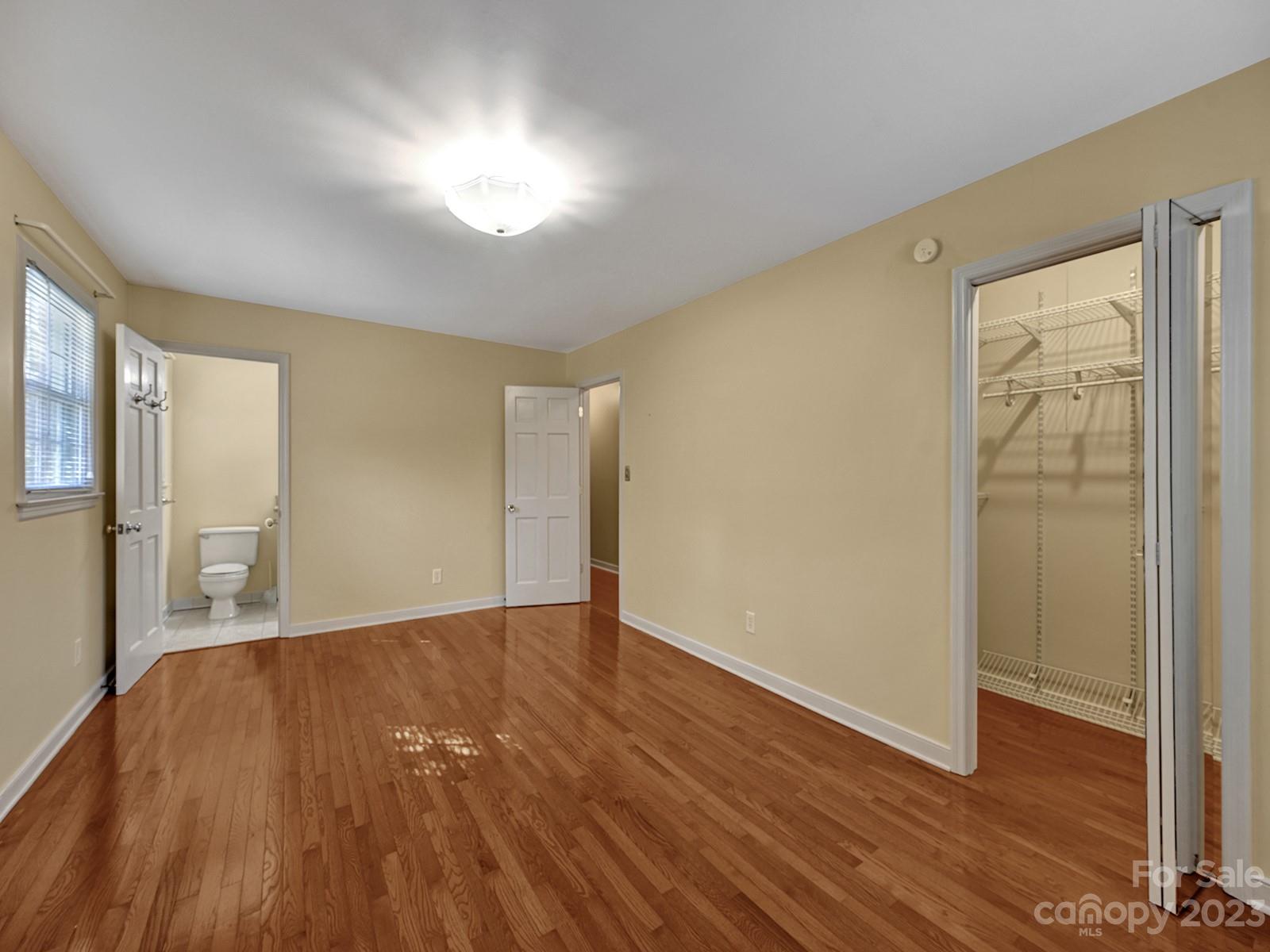 4130 Witherow Road Winston-Salem, NC 27106 - Photo 23 of 39 a view of an empty room with wooden floor and a window