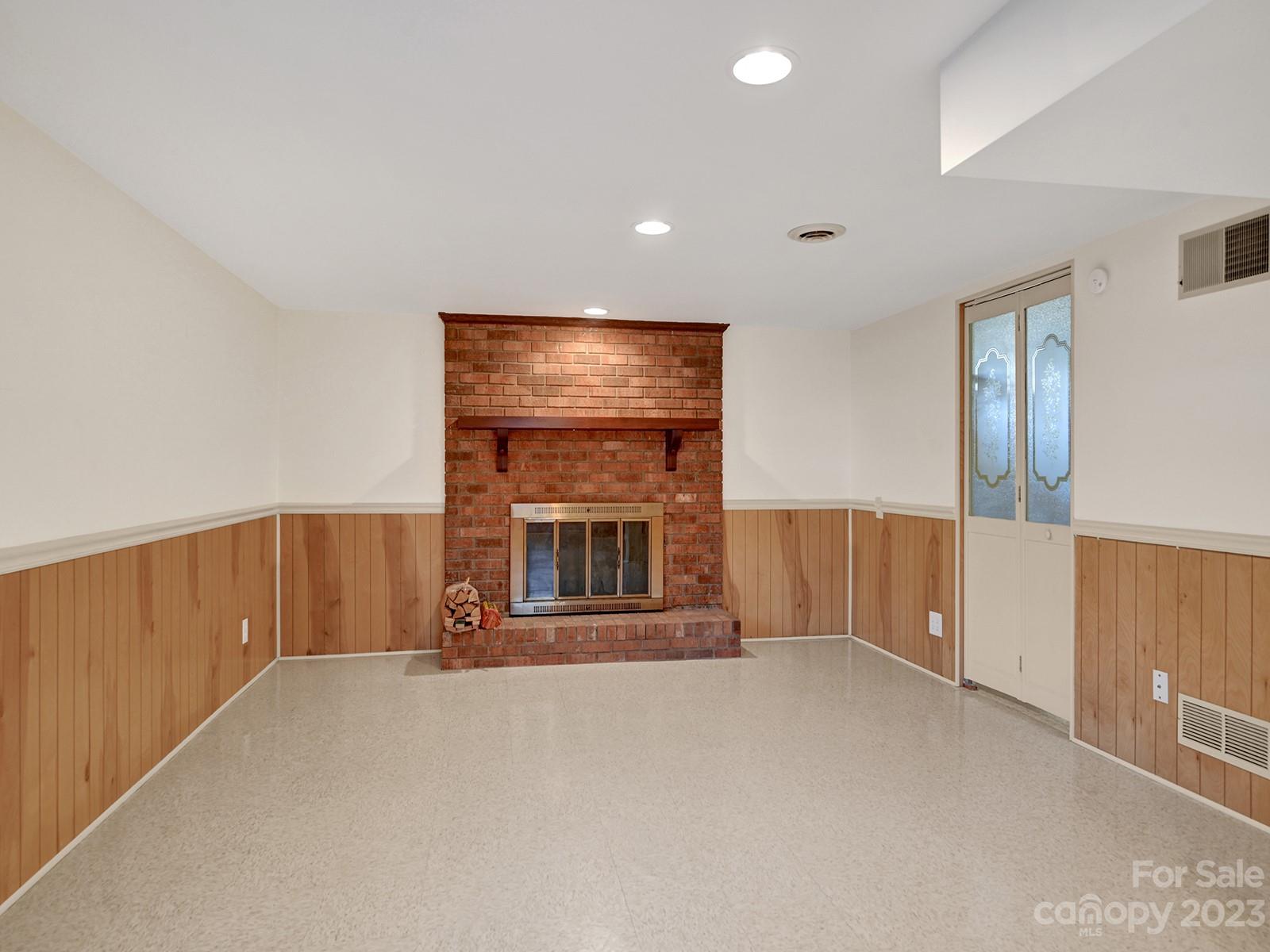 4130 Witherow Road Winston-Salem, NC 27106 - Photo 28 of 39 a view of an empty room with a fireplace