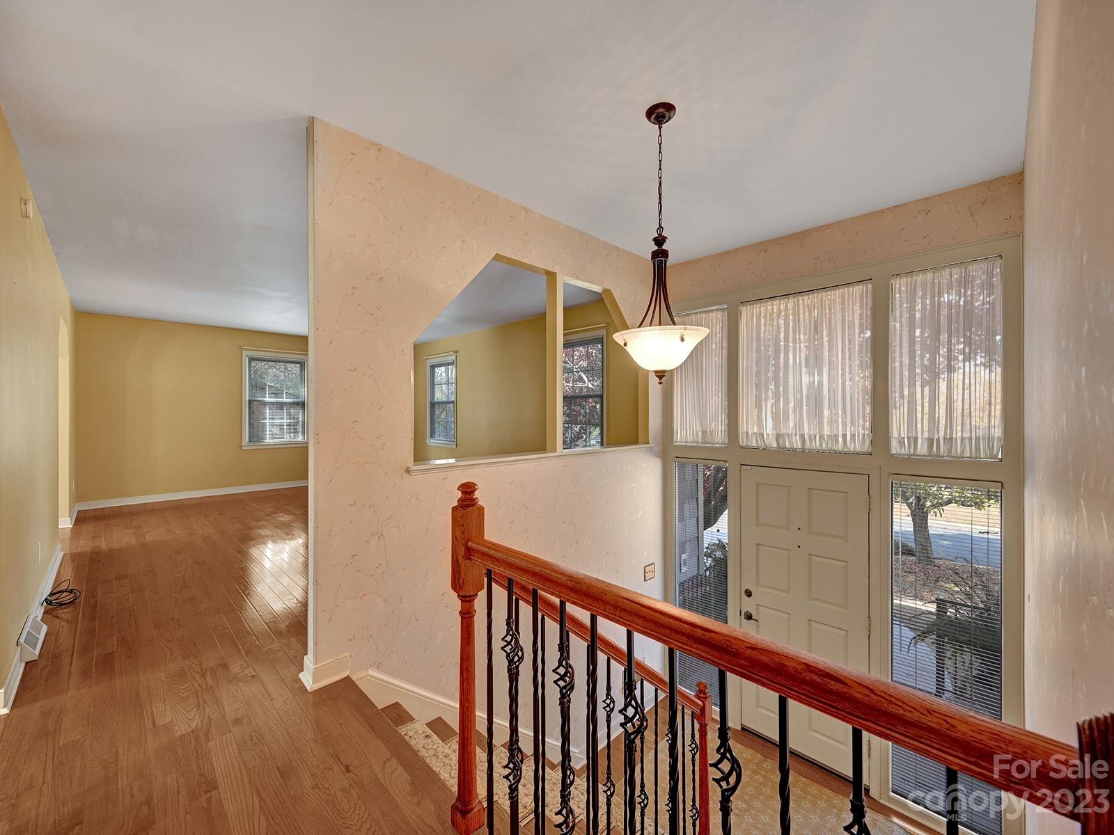 4130 Witherow Road Winston-Salem, NC 27106 - Photo 7 of 39 a view of a room with wooden floor stairs