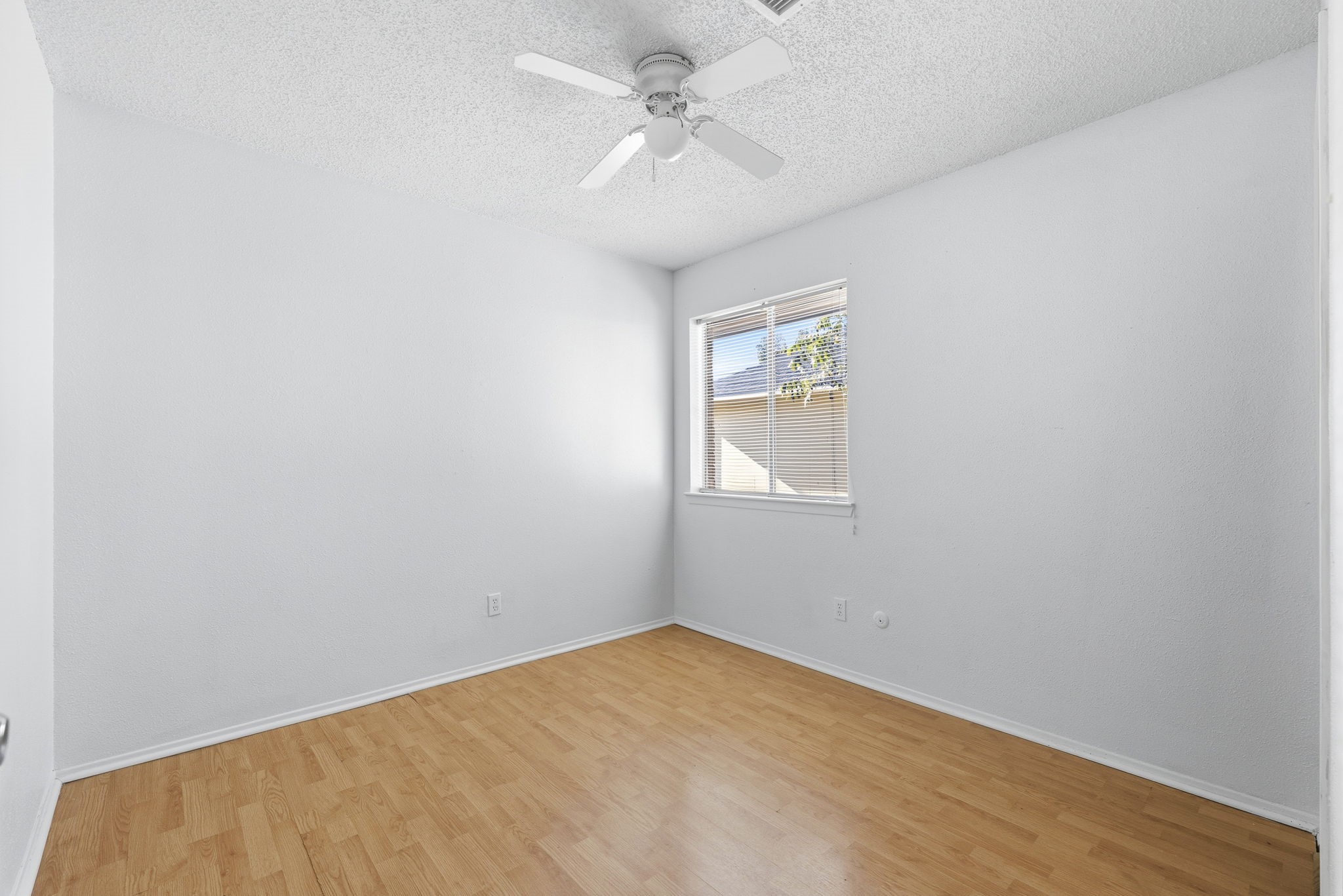 23314 Prairie Bird Drive Spring, TX 77373 - Photo 16 of 20 an empty room with windows and fan