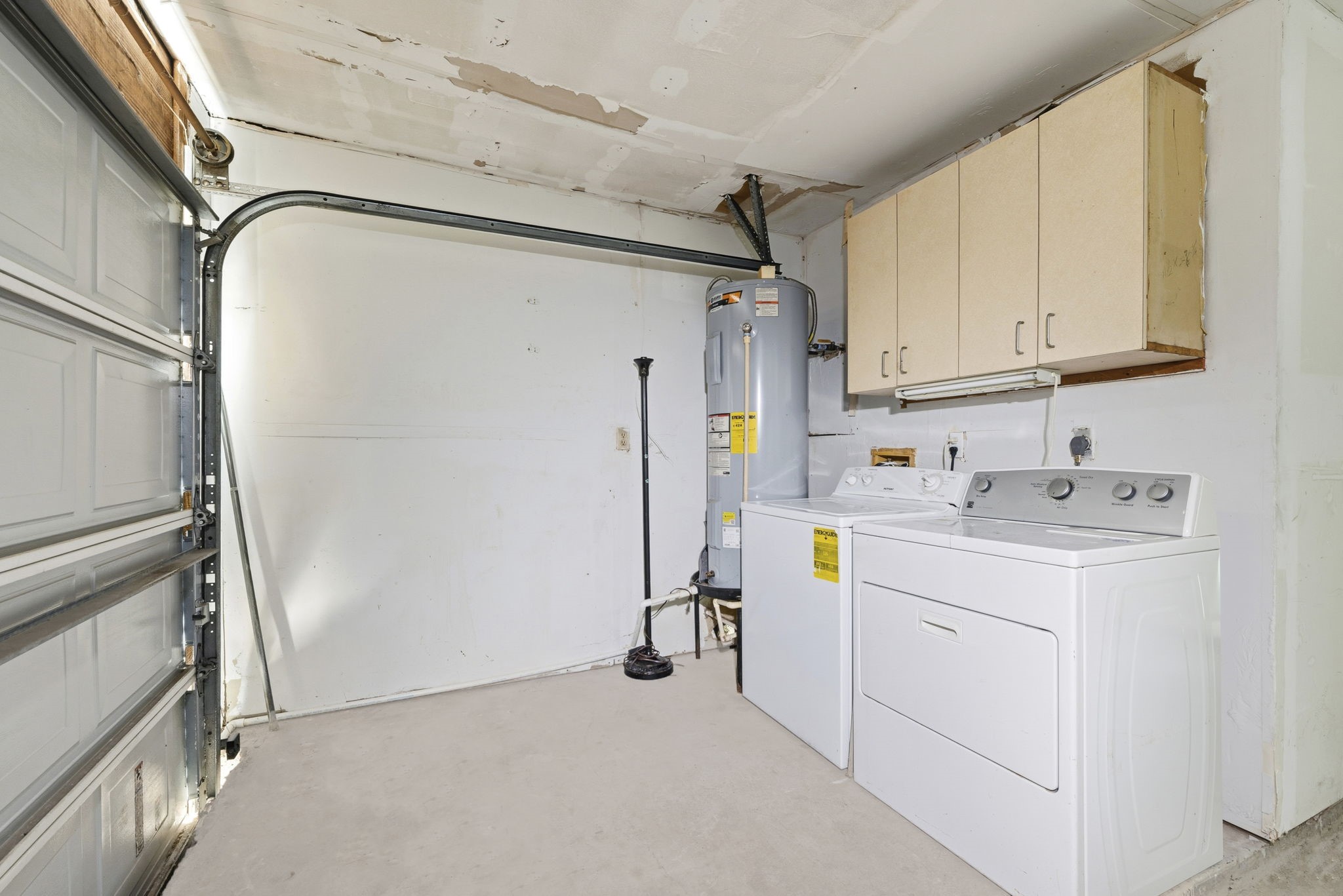 23314 Prairie Bird Drive Spring, TX 77373 - Photo 17 of 20 a view of storage and utility room with a washer dryer