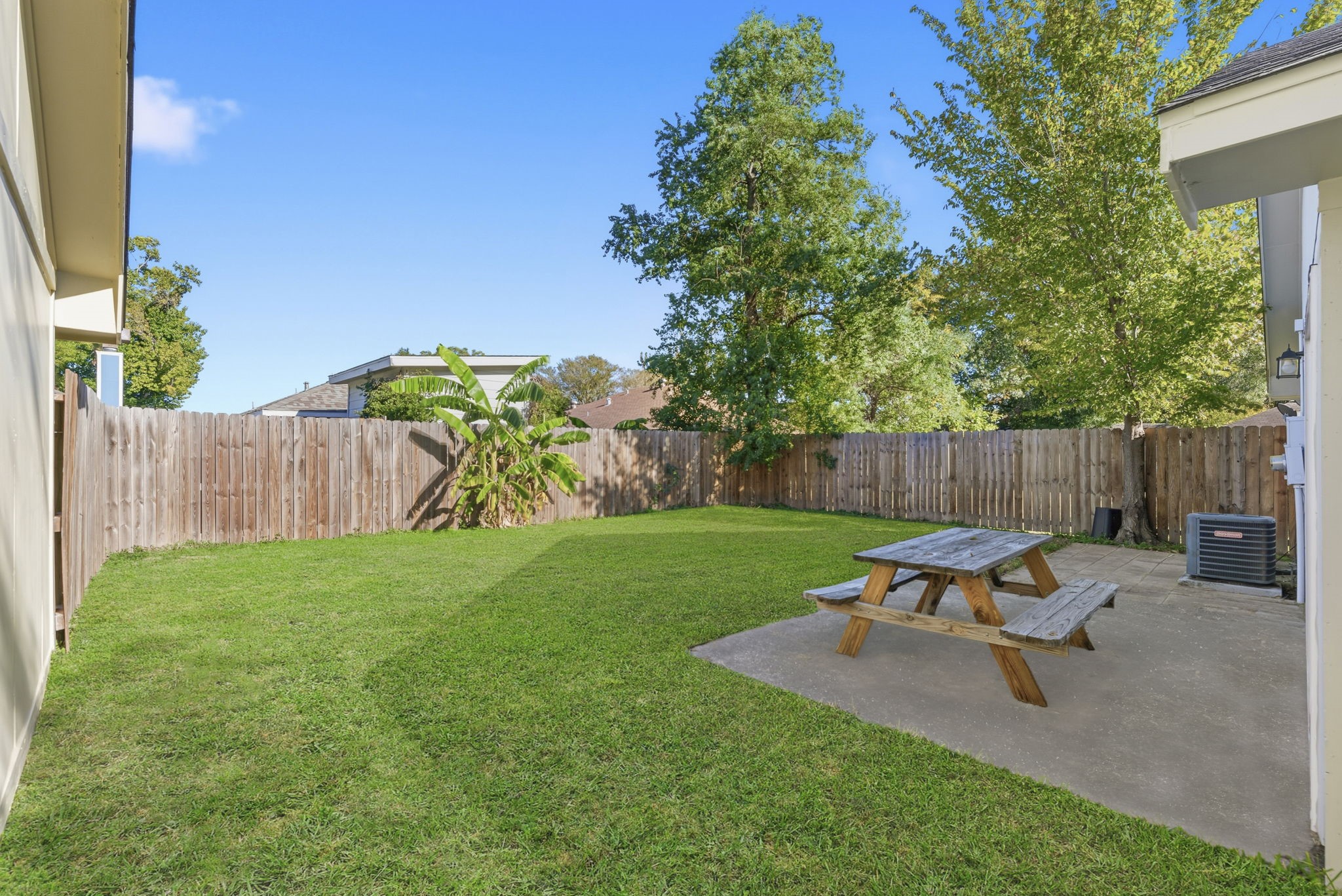 23314 Prairie Bird Drive Spring, TX 77373 - Photo 18 of 20 a view of a backyard with a table and chairs