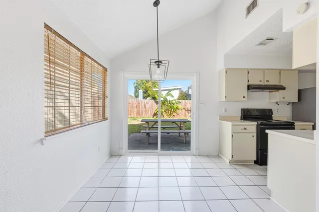 a kitchen with appliances cabinets and a counter top space