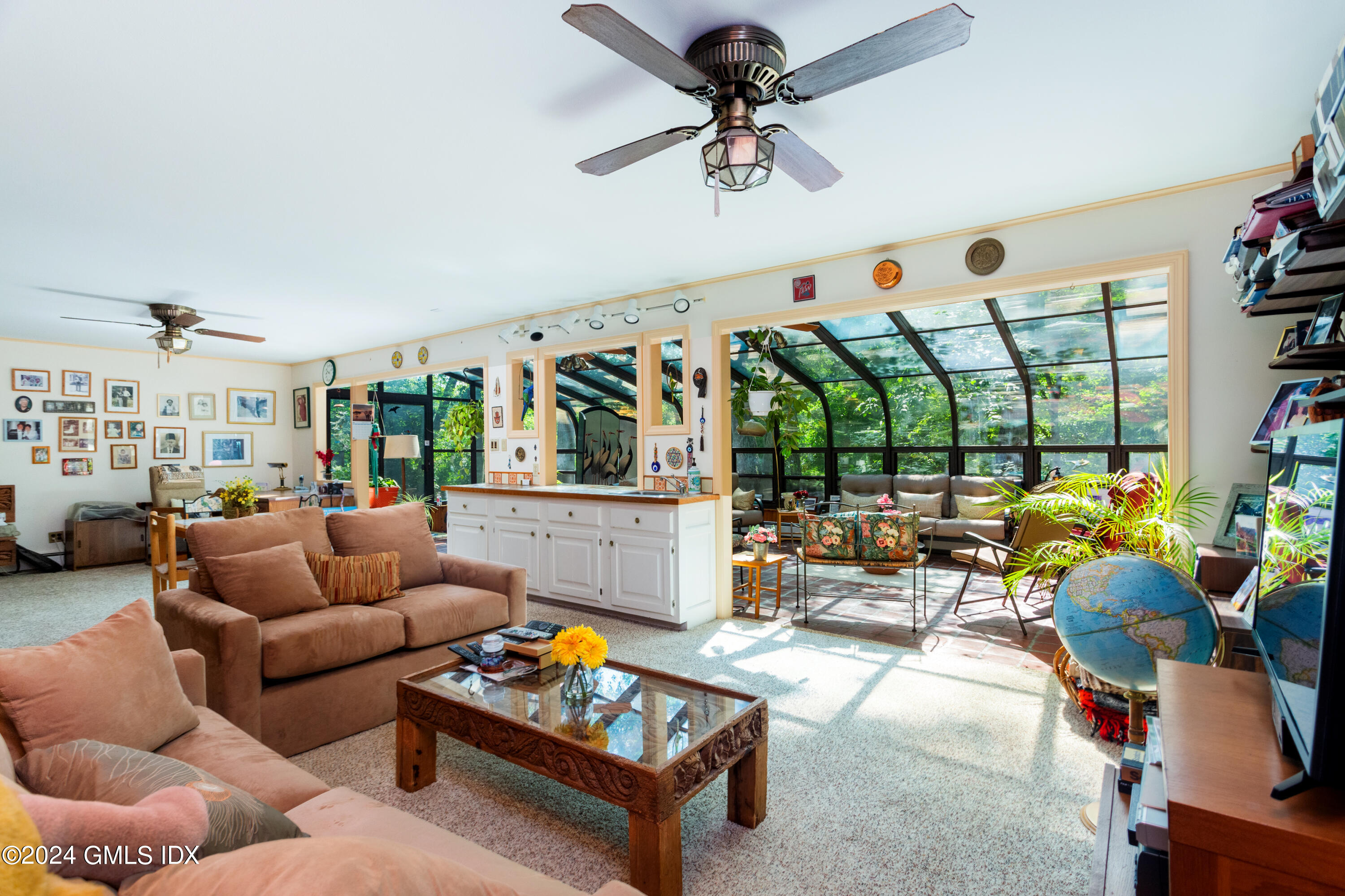 45 Cousins Road Stamford, CT 06903 - Photo 11 of 23 a living room with patio furniture and a floor to ceiling window