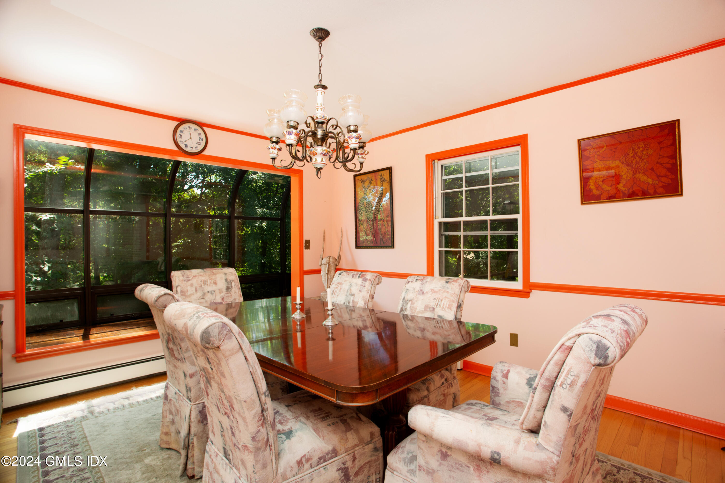 45 Cousins Road Stamford, CT 06903 - Photo 4 of 23 a view of a dining room with furniture wooden floor and chandelier