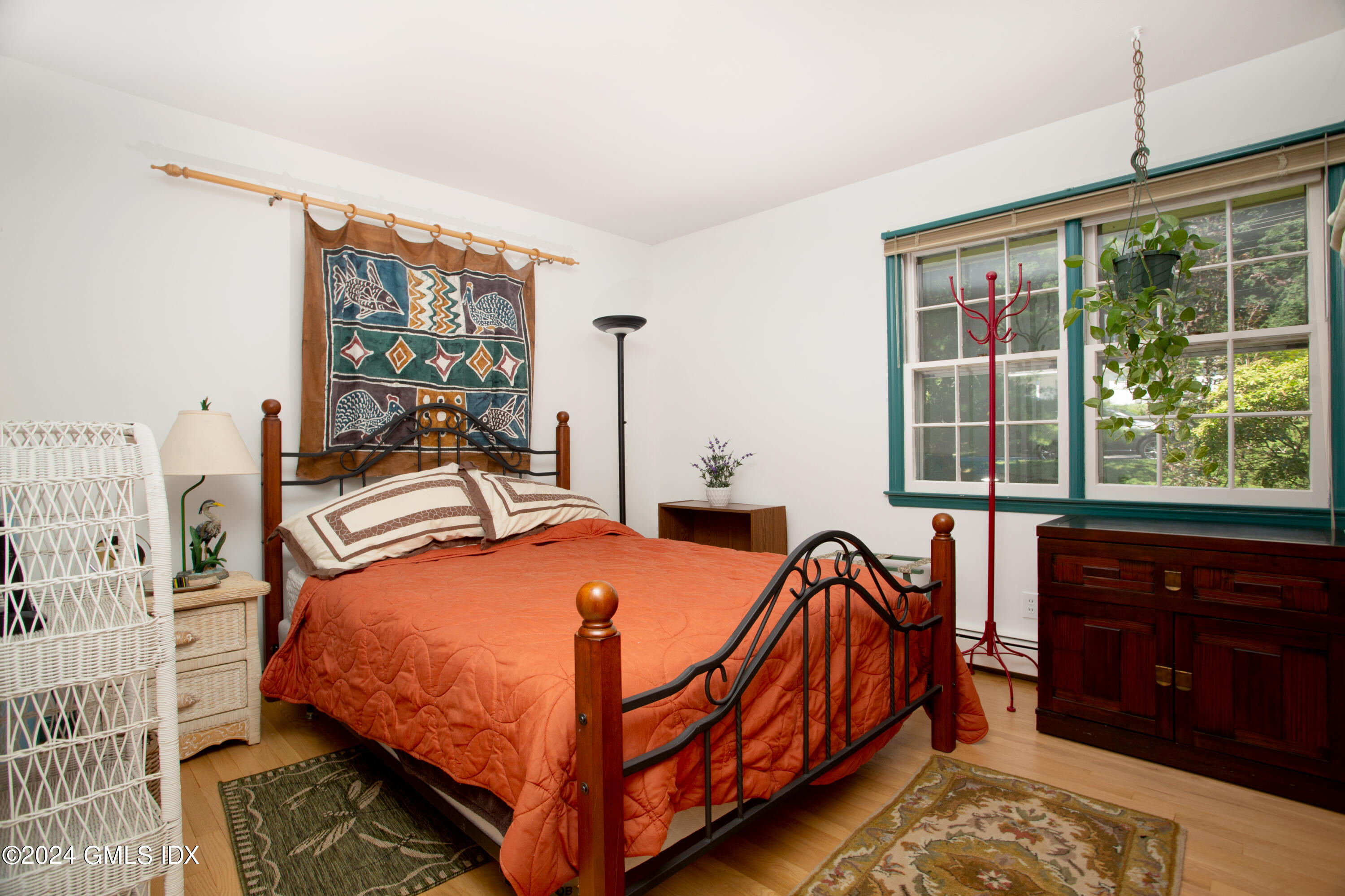 45 Cousins Road Stamford, CT 06903 - Photo 6 of 23 a bedroom with a bed and wooden floor