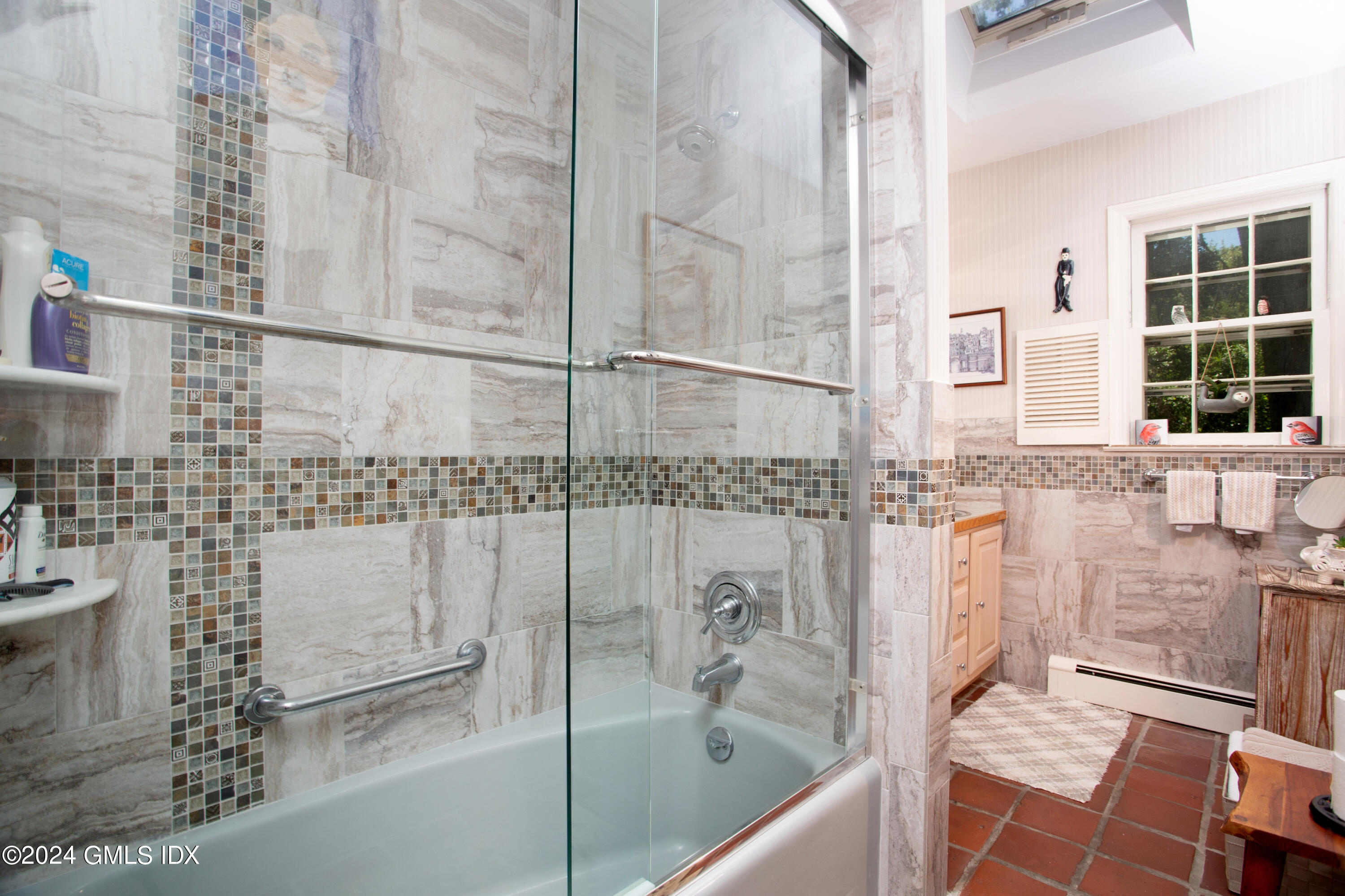 45 Cousins Road Stamford, CT 06903 - Photo 7 of 23 a bathroom with a bathtub and a shower