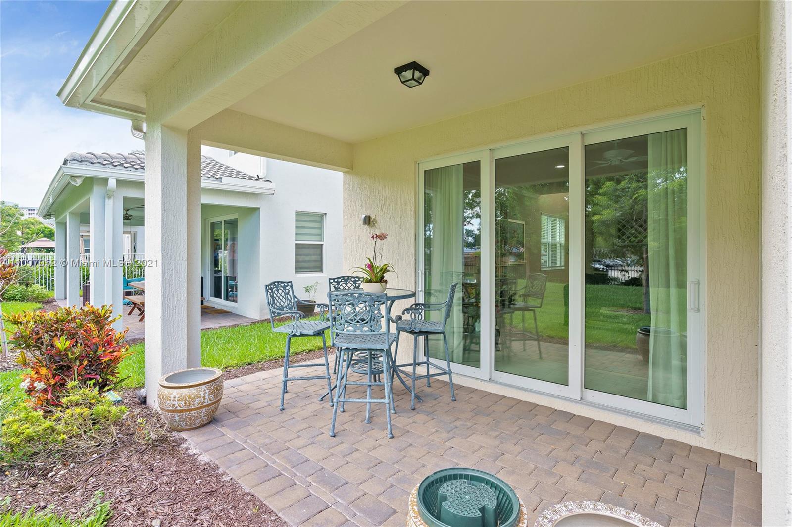 4325 Large Leaf Lane Hollywood, FL 33021 - Photo 14 of 42 a dining room with furniture and a garden