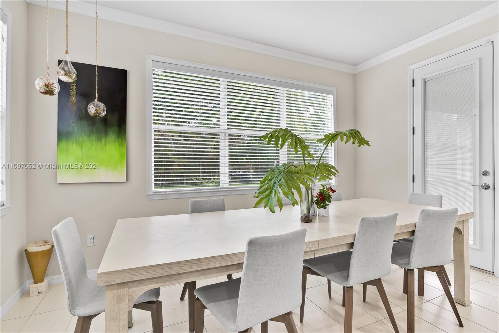 4325 Large Leaf Lane Hollywood, FL 33021 - Photo 25 of 42 a view of a dining room with furniture and a window