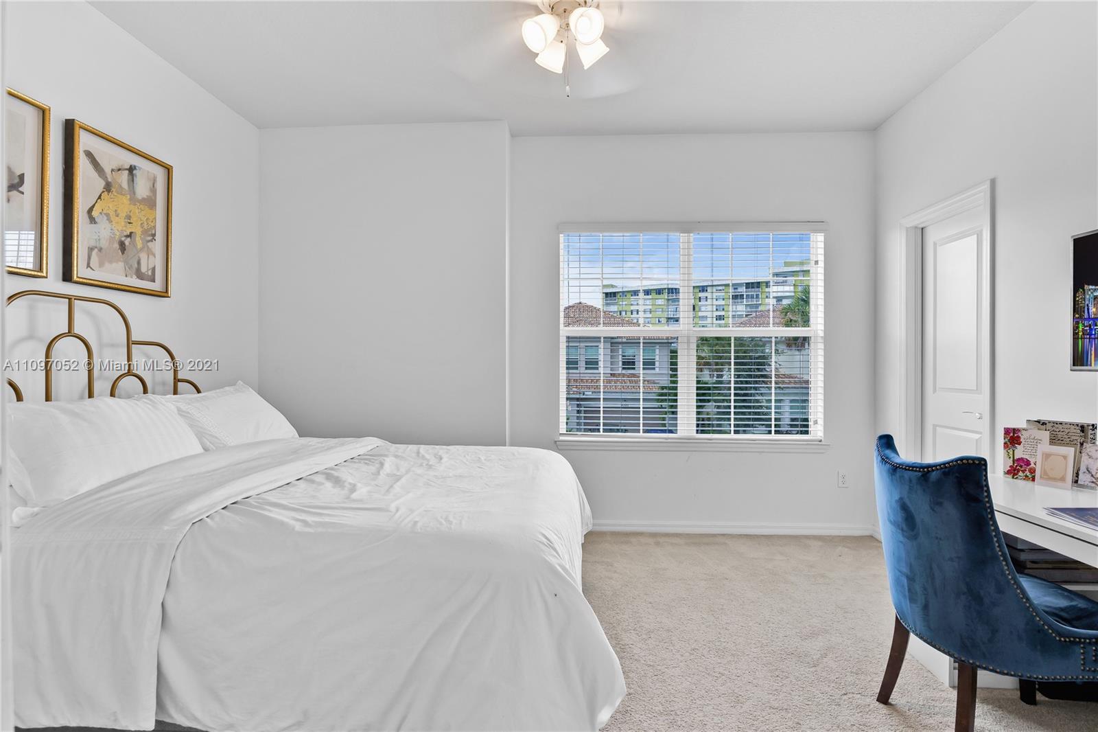 4325 Large Leaf Lane Hollywood, FL 33021 - Photo 30 of 42 a bedroom with a bed and a large window