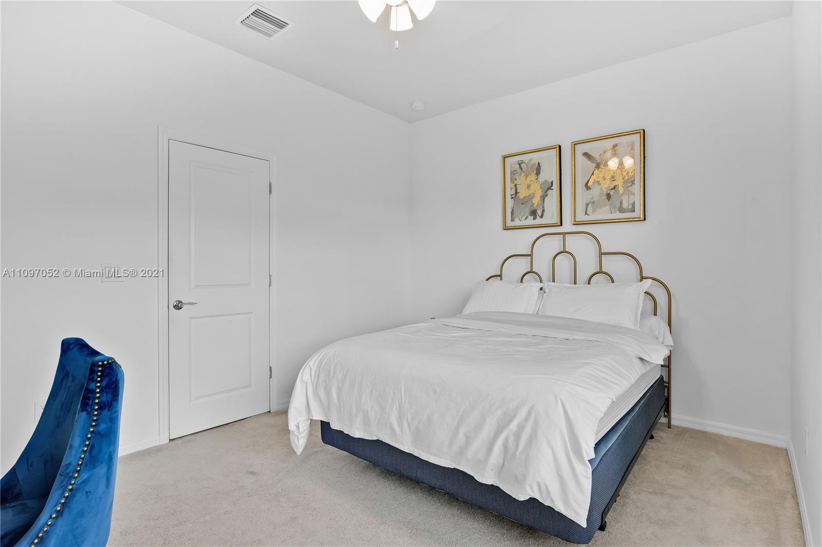 4325 Large Leaf Lane Hollywood, FL 33021 - Photo 31 of 42 a bedroom with a bed and a table
