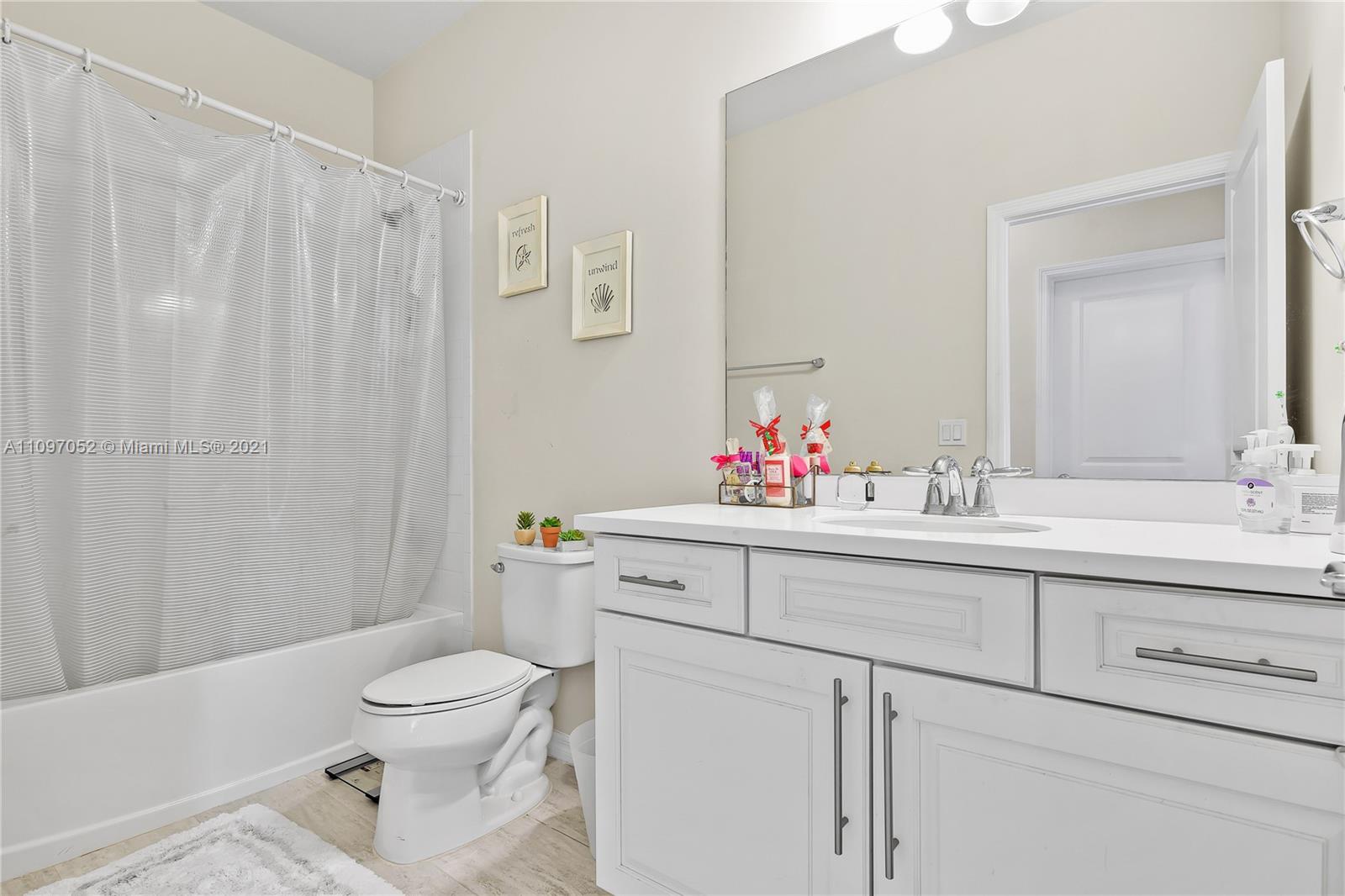 4325 Large Leaf Lane Hollywood, FL 33021 - Photo 33 of 42 a bathroom with a sink toilet and shower