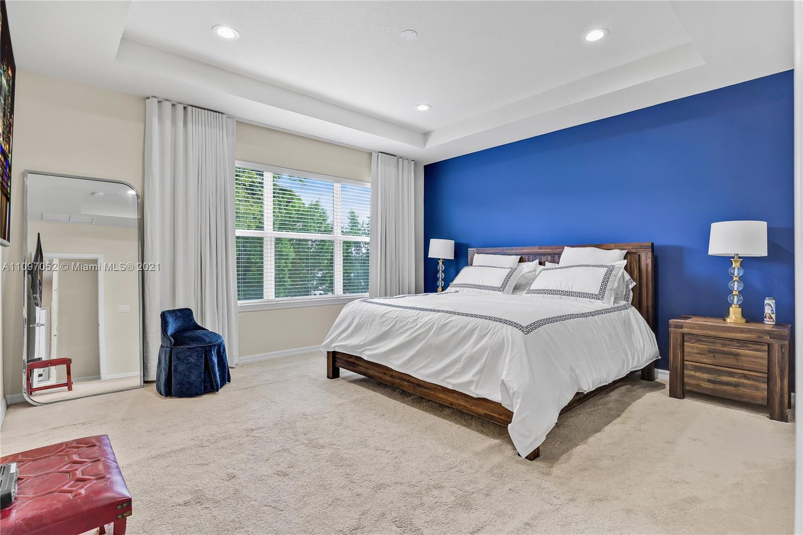 4325 Large Leaf Lane Hollywood, FL 33021 - Photo 35 of 42 a spacious bedroom with a bed and a couch
