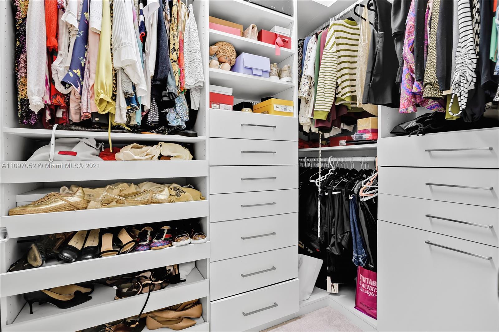 4325 Large Leaf Lane Hollywood, FL 33021 - Photo 40 of 42 a view of walk in closet with clothes and shoes