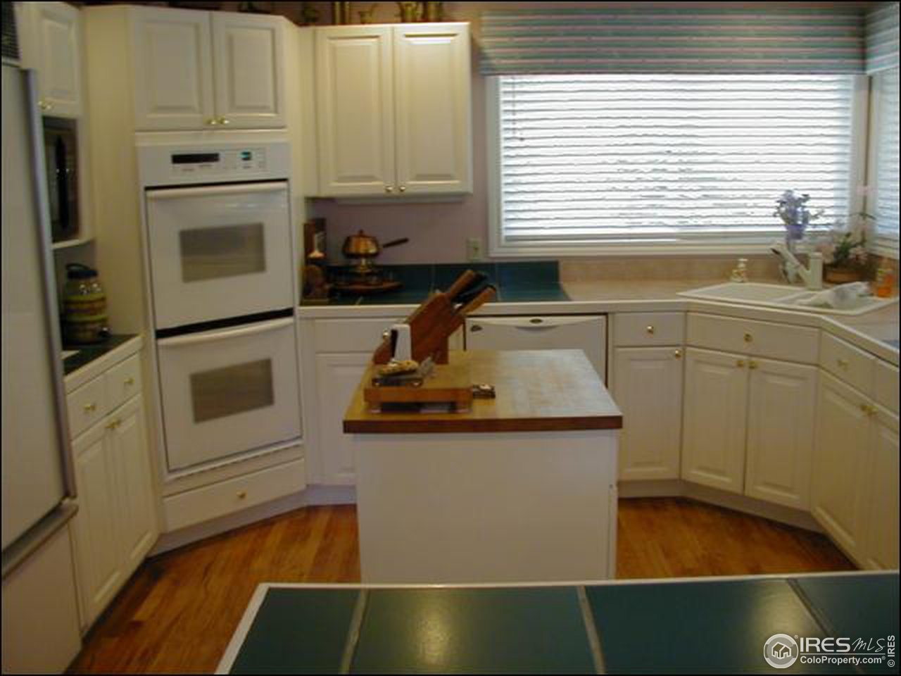 7223 Four Rivers Road Boulder, CO 80301 - Photo 5 of 12 a kitchen with granite countertop a sink and a stove top oven