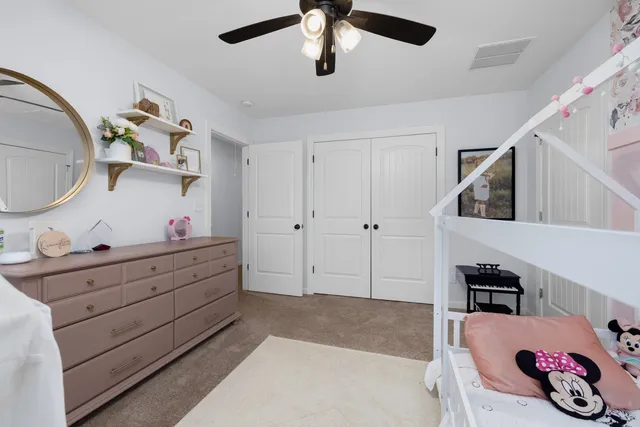 a living room with furniture and white walls