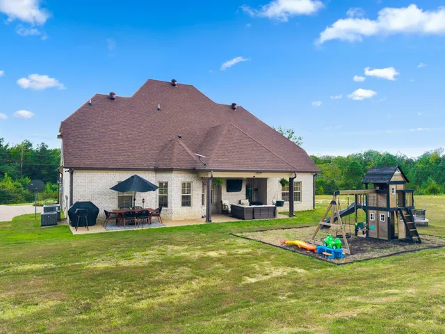 a view of a outdoor space with deck and flat screen tv