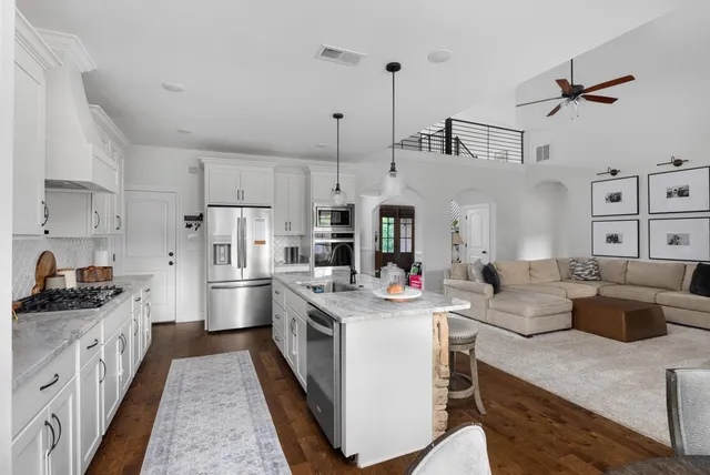 a view of a house with swimming pool and a yard