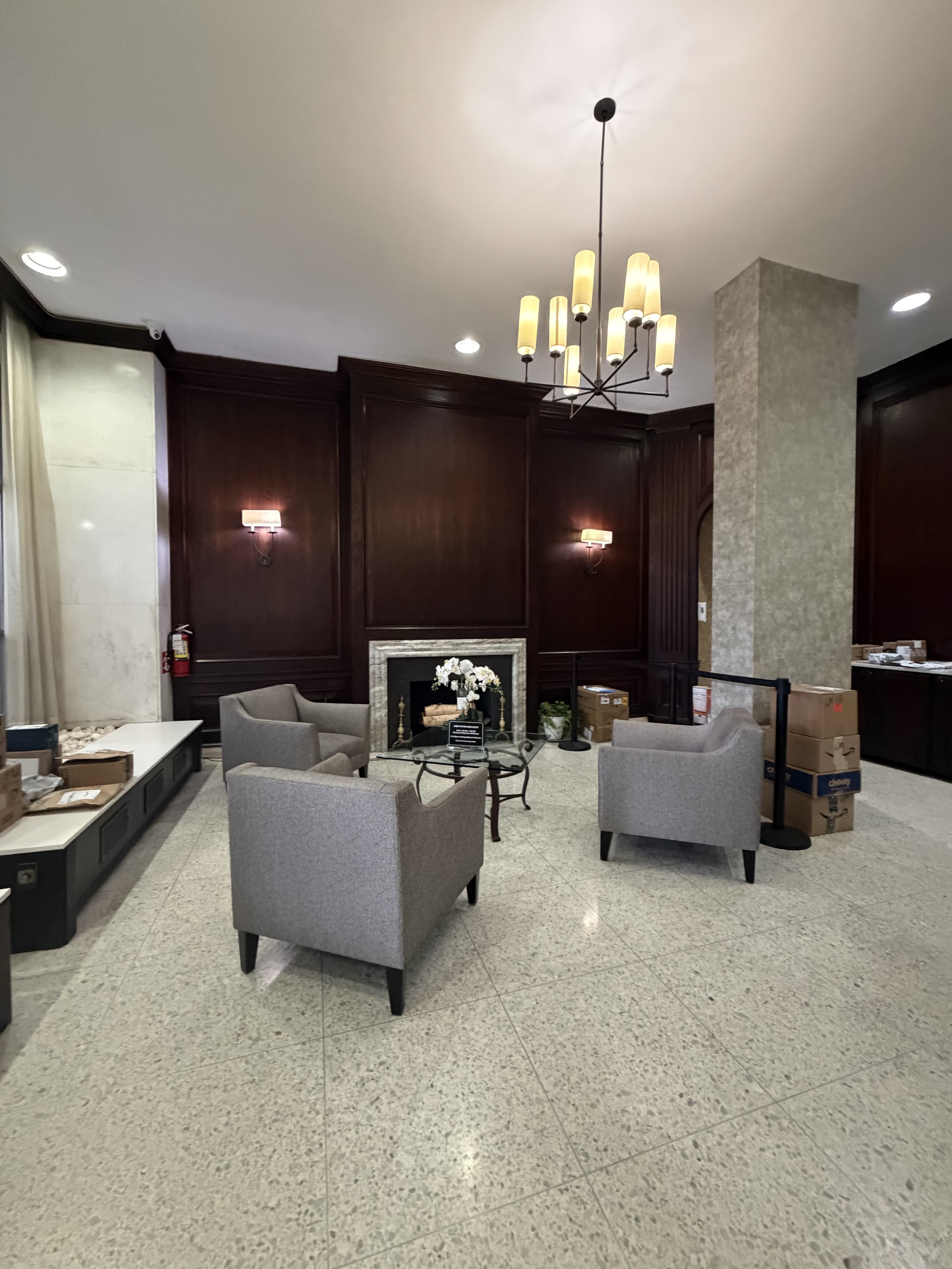 85-15 Main Street, Unit 2R Queens, NY 11435 - Photo 14 of 15 a living room with furniture and a chandelier