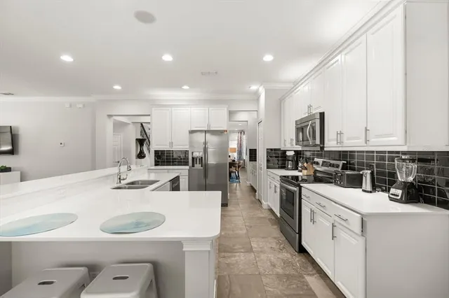 a view of a dining room with furniture and window