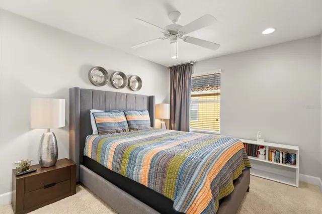 a bedroom with a bed and cabinets