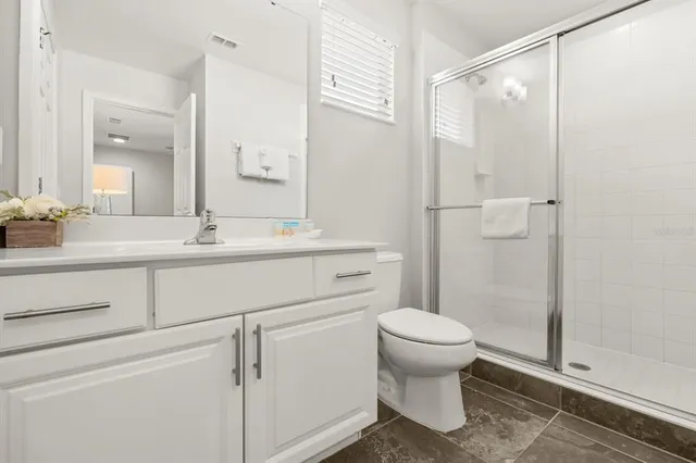 a view of staircase with white walls and windows