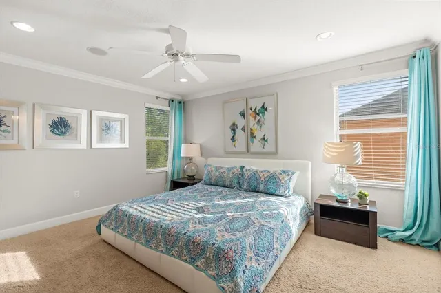 a dining room with furniture and a floor to ceiling window