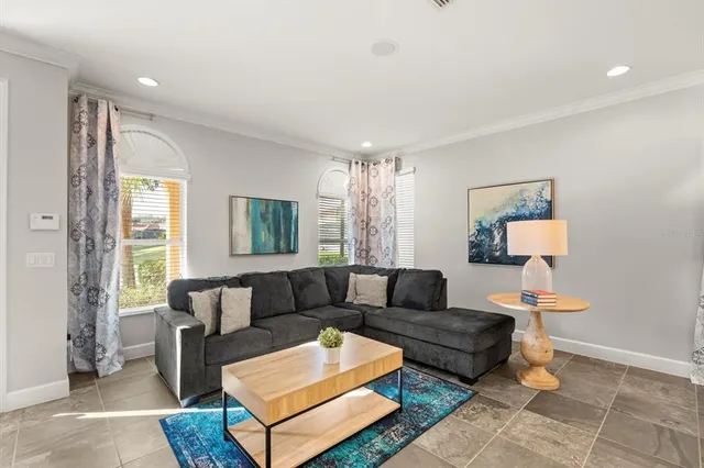 a living room with a couch and a window