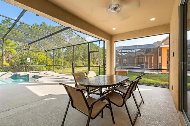 an aerial view of residential houses with outdoor space and river