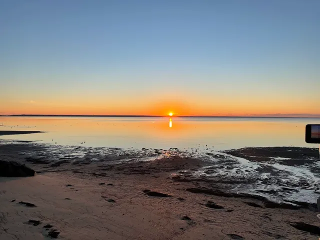 an aerial view of ocean and beach
