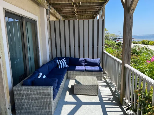 a view of balcony with furniture