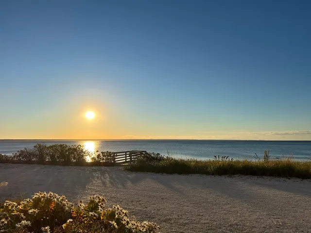 a view of an ocean and city