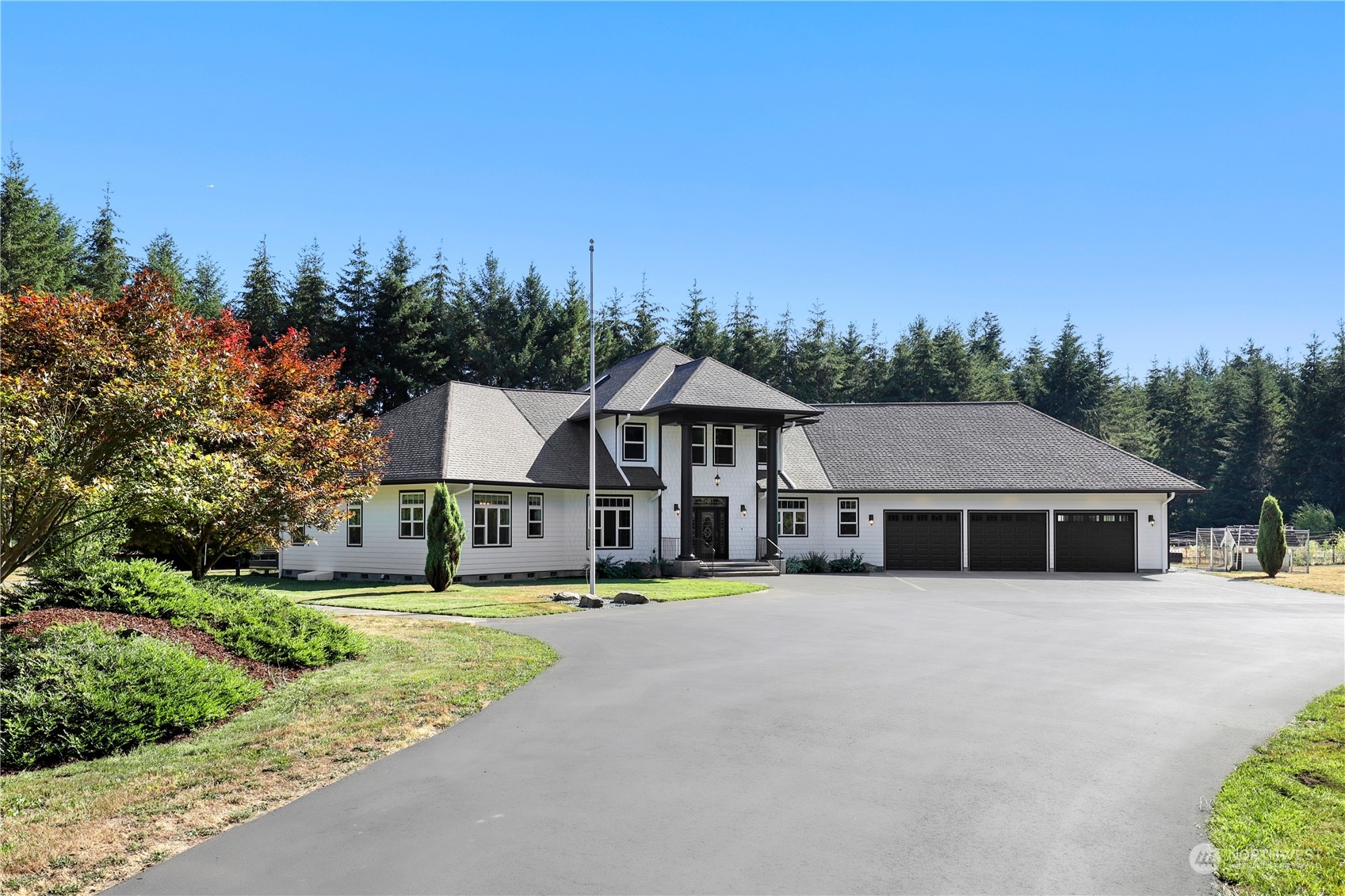 9109 Rich Road Southeast Olympia, WA 98501 - Photo 39 of 40 a front view of a house with a garden and trees