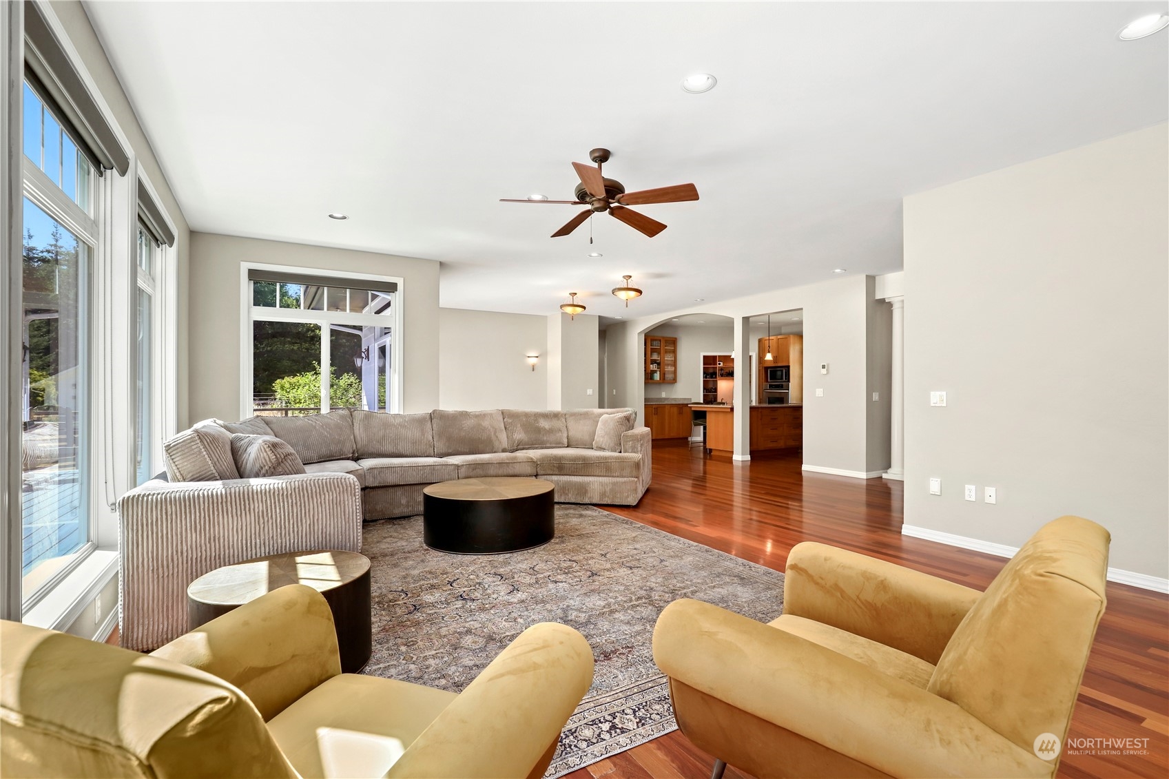 9109 Rich Road Southeast Olympia, WA 98501 - Photo 6 of 40 a living room with furniture a rug and a chandelier
