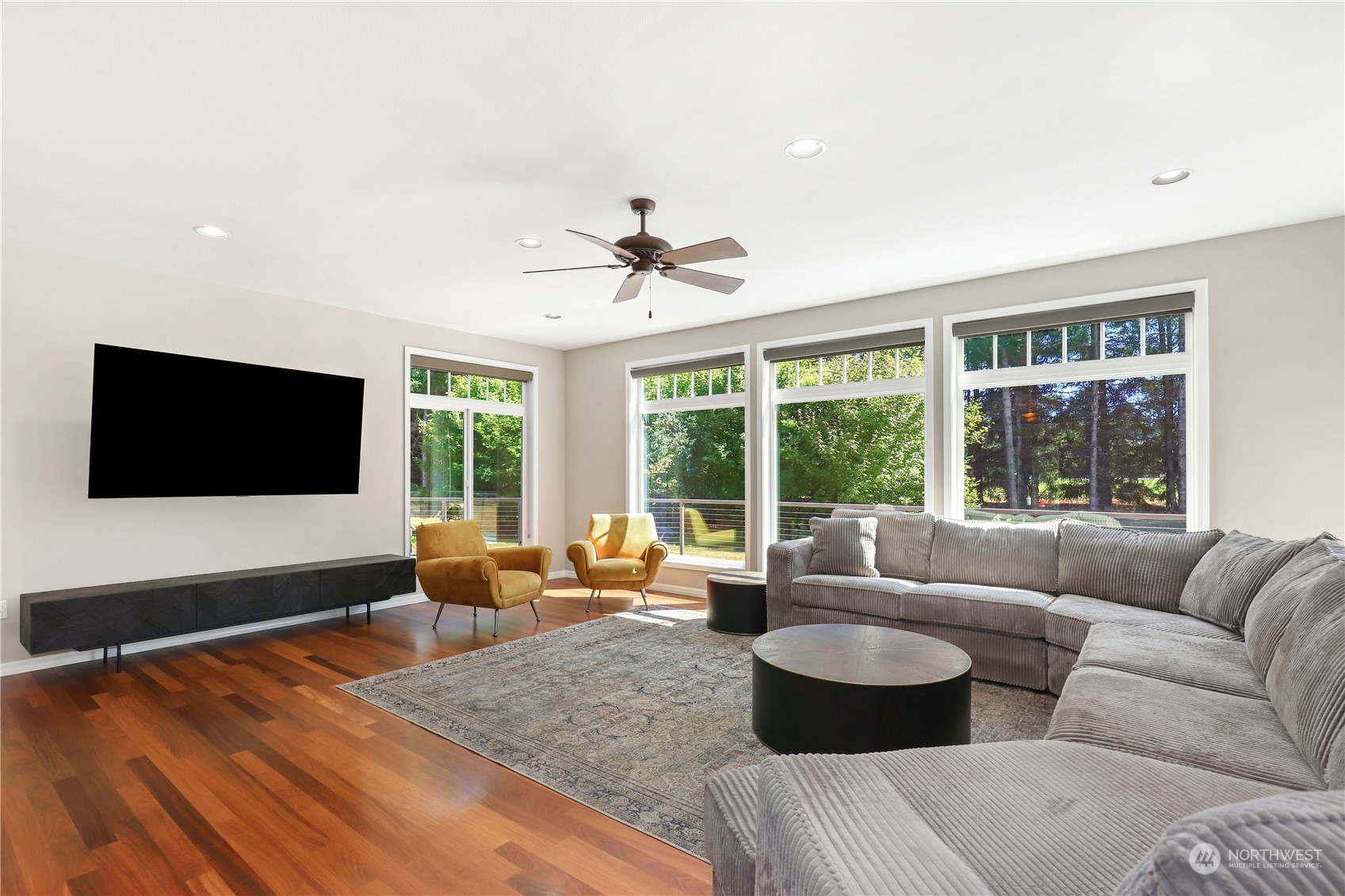 9109 Rich Road Southeast Olympia, WA 98501 - Photo 8 of 40 a living room with furniture and a flat screen tv