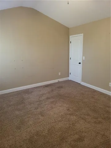 a view of a room with wooden floor and bedroom